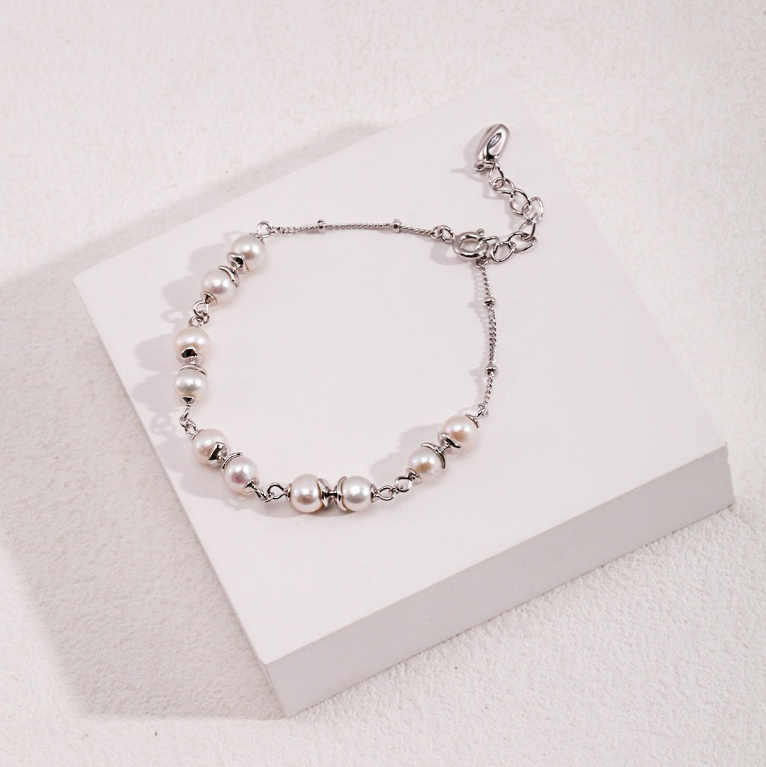 Elegant Interlaced Pearl Bracelet with Sterling Silver